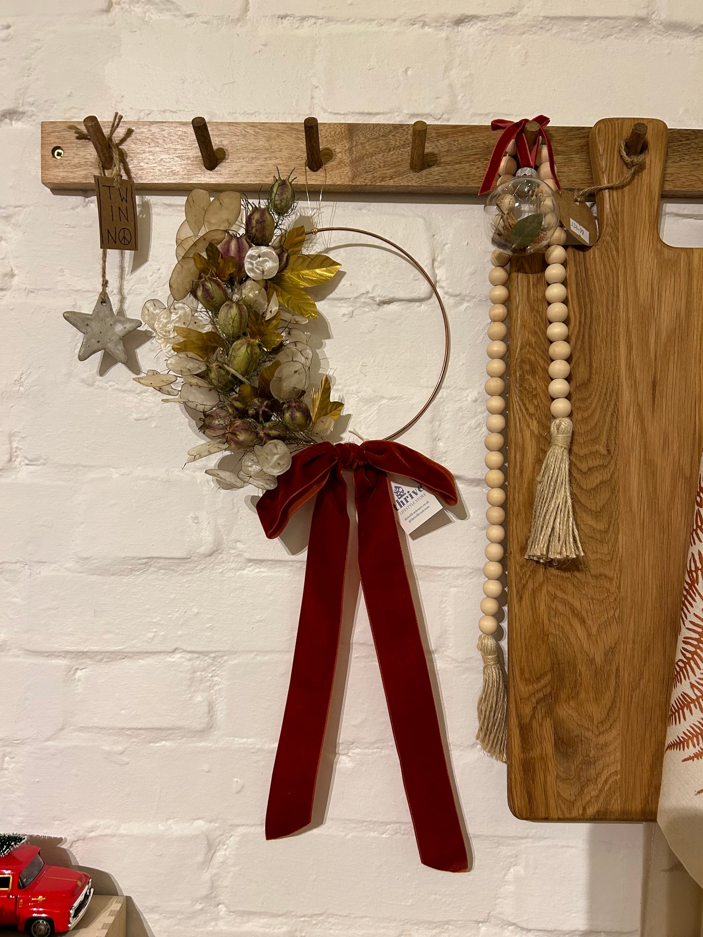 Dried flower and brass leaf wreath