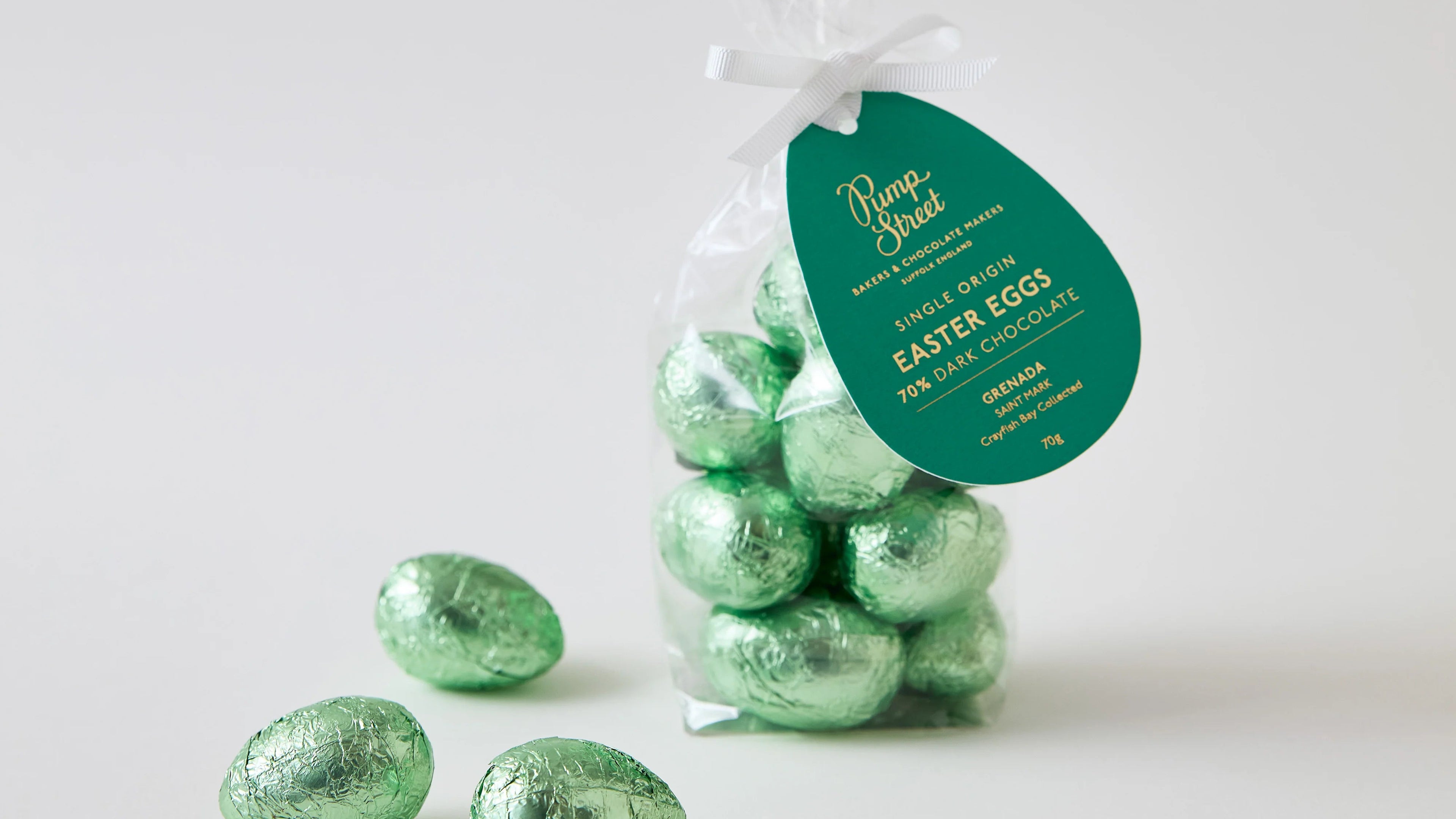 Bag of green Easter eggs with a visible brand label on a white background